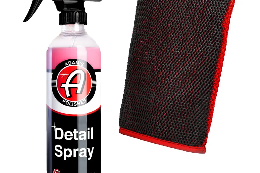 Adam's Polishes clay infused mitt next to a bottle of Adam's Detail Spray clay lubricant