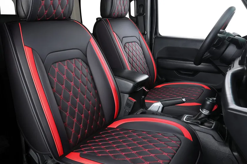 Aierxuan waterproof faux leather seat covers in black with red stitching installed on Jeep Wrangler 4-door seats