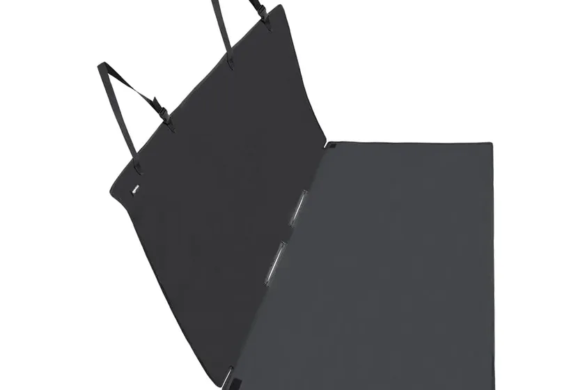 Amazon Basics black waterproof bench-style dog seat cover laid flat across a rear car seat