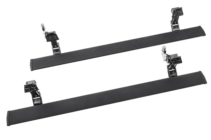 AMP Research PowerStep retractable electric running board deployed under a Chevy Silverado door with LED light
