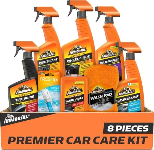 Armor All Ultimate Premier Car Care Kit with its eight pieces laid out, including tire shine, glass cleaner, wash and wax and a microfiber wash pad