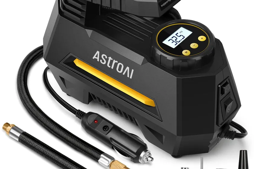 AstroAI AIRUN H yellow 12V portable air compressor with a digital pressure screen and coiled power cord