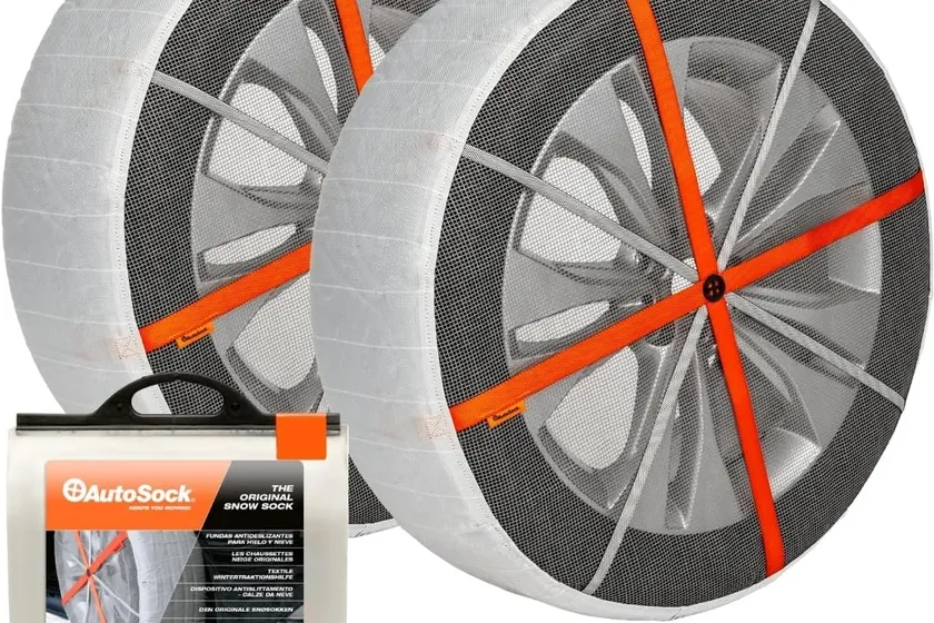 White AutoSock HP697 textile snow sock stretched over a car tire with the fabric covering the tread face