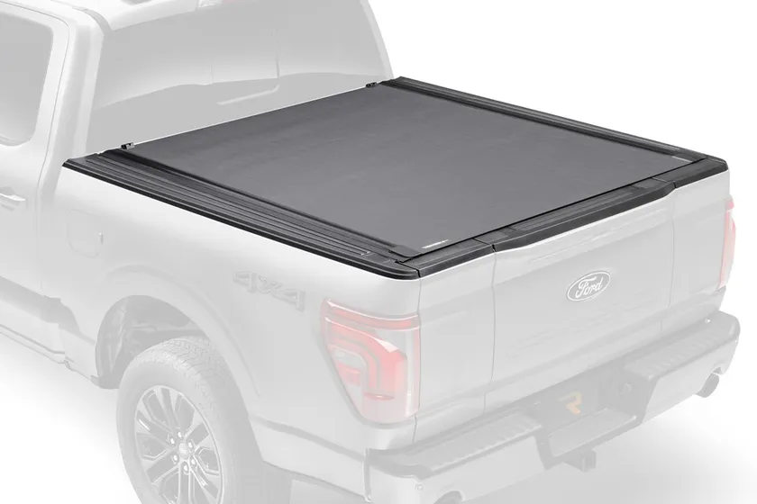 BAK Revolver X4s hard rolling tonneau cover partially rolled open on a pickup truck bed
