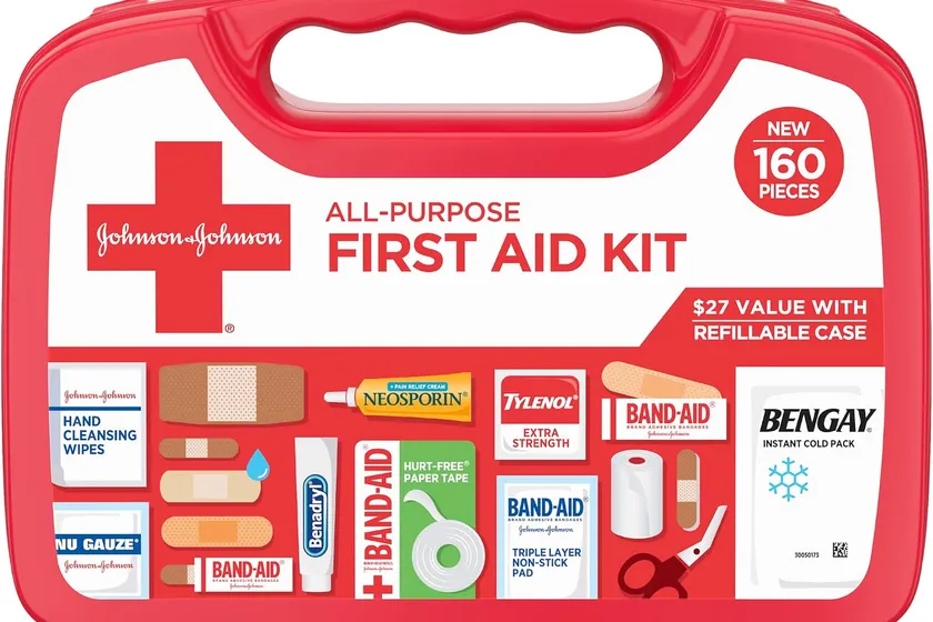 Band-Aid Brand red 160 piece all-purpose first aid kit case opened to show bandages, gauze, creams and a cold pack