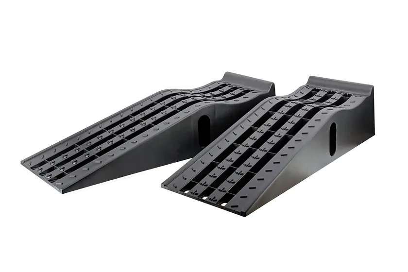 Pair of black MaxxHaul 50515 molded plastic car service ramps with deep grooved tire channels