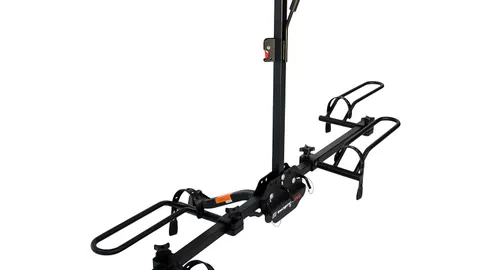 Black steel platform hitch bike rack with two wheel trays mounted in a vehicle receiver