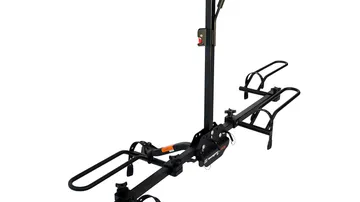 Black steel platform hitch bike rack with two wheel trays mounted in a vehicle receiver