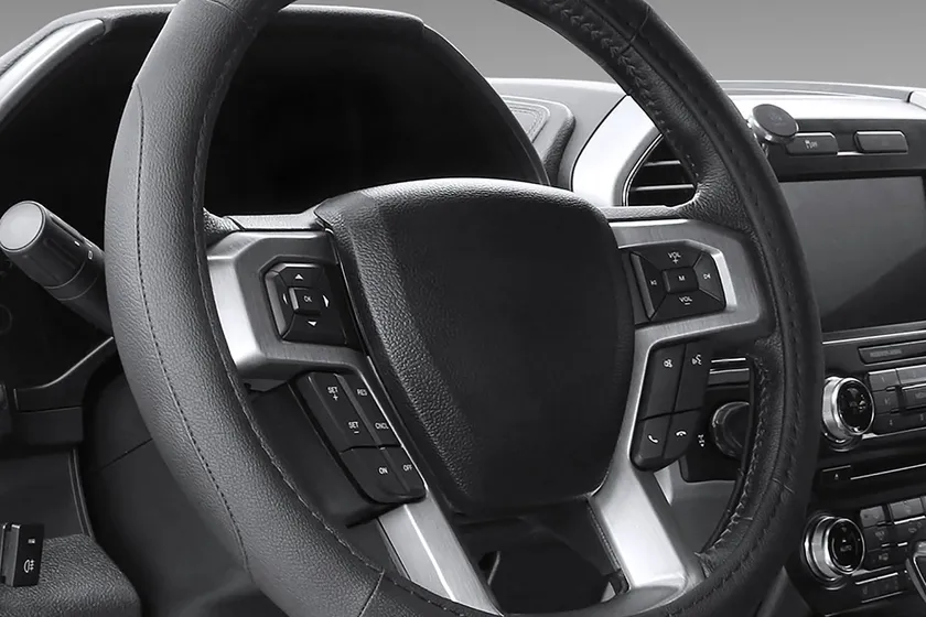 SEG Direct black microfiber leather steering wheel cover shown fitted to a car steering wheel