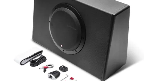 Slim sealed powered subwoofer enclosure sized to fit behind a pickup truck seat