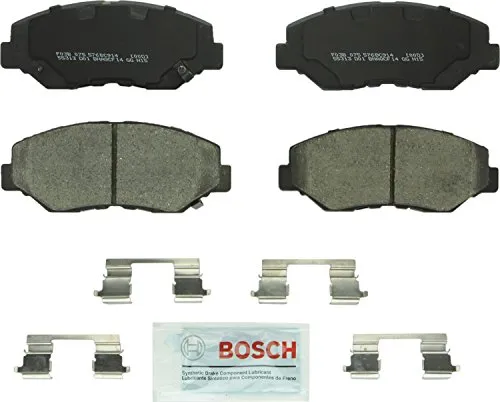 Bosch BC914 QuietCast ceramic front brake pad set showing the powder-coated backing plates and pre-attached rubber core shims