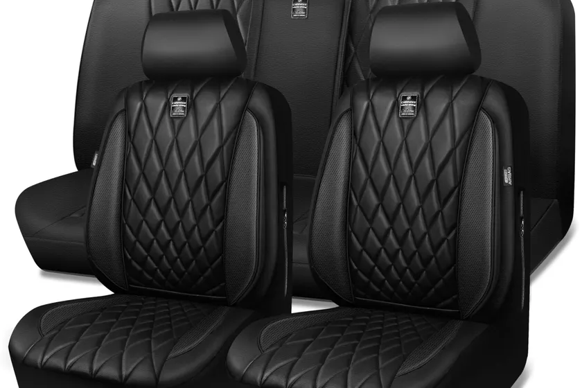 Black CAR PASS faux leather seat covers with piped stitching shown on front bucket seats and rear bench