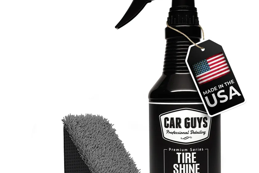 CAR GUYS tire shine spray bottle with a black foam applicator pad next to a glossy black tire