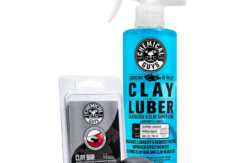Chemical Guys heavy duty black clay bar next to a bottle of Clay Luber synthetic lubricant