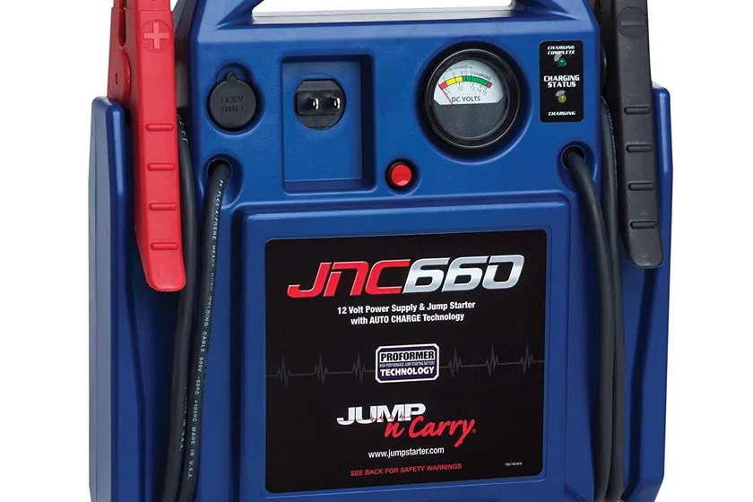 Clore Automotive Jump-N-Carry JNC660 blue lead-acid jump starter box with long cables and heavy clamps