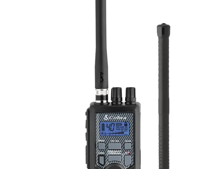 Cobra HHRT50 Road Trip handheld CB radio next to its magnetic rooftop mount antenna