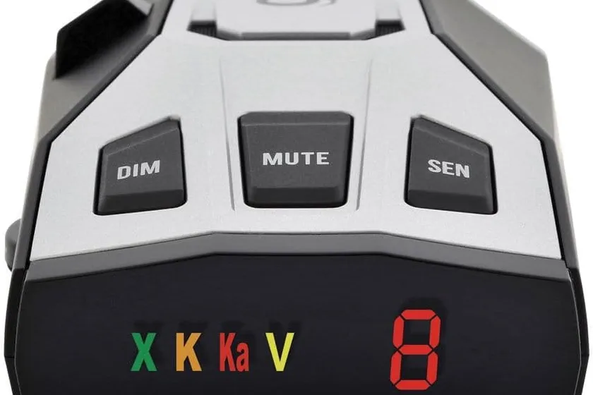 Cobra RAD 350 radar detector with its 7-segment color display showing a band alert