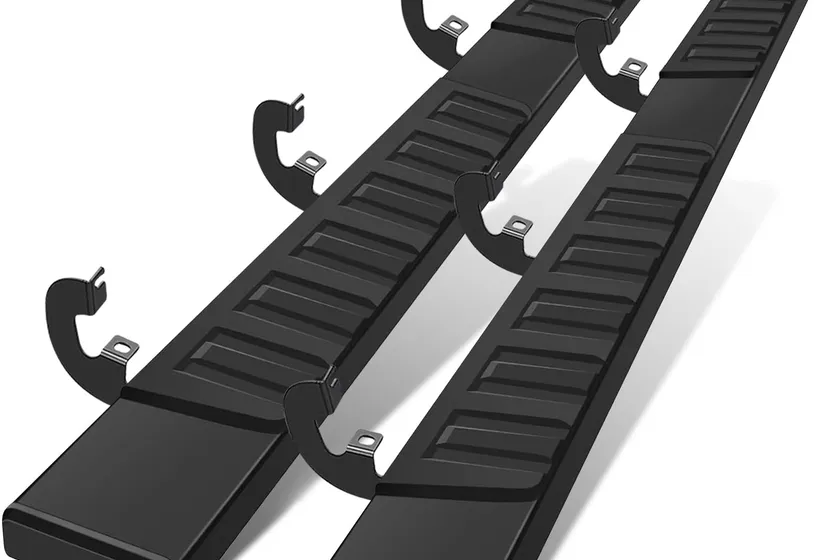 COMNOVA 6 inch black running boards with full-length tread pads for a Chevy Silverado crew cab