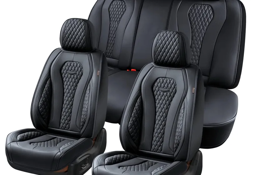 Black Coverado leatherette seat covers installed on the front and rear seats of a sedan