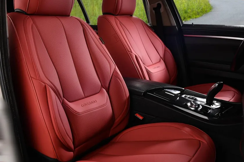 Black Coverado waterproof faux leather front seat covers installed on a pair of car bucket seats