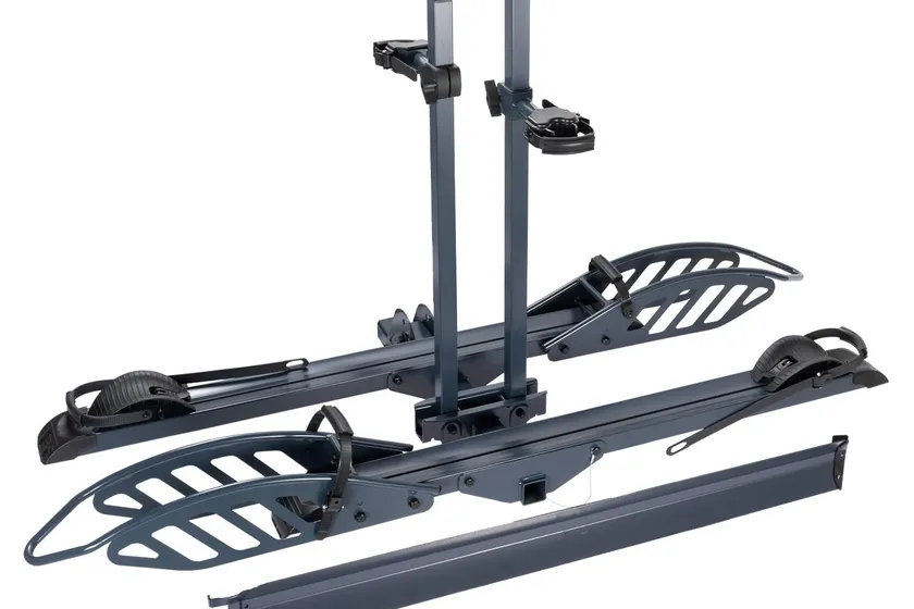 CyberRack E2 black platform hitch bike rack loaded with two electric bikes and a loading ramp