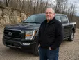 Dale Harper standing in front of his Ford F-150 Raptor