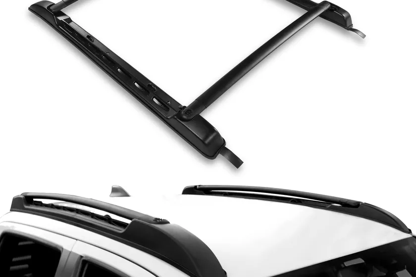 Dermon black aluminum roof rack cross bars mounted on the factory rails of a Toyota Tacoma four-door cab