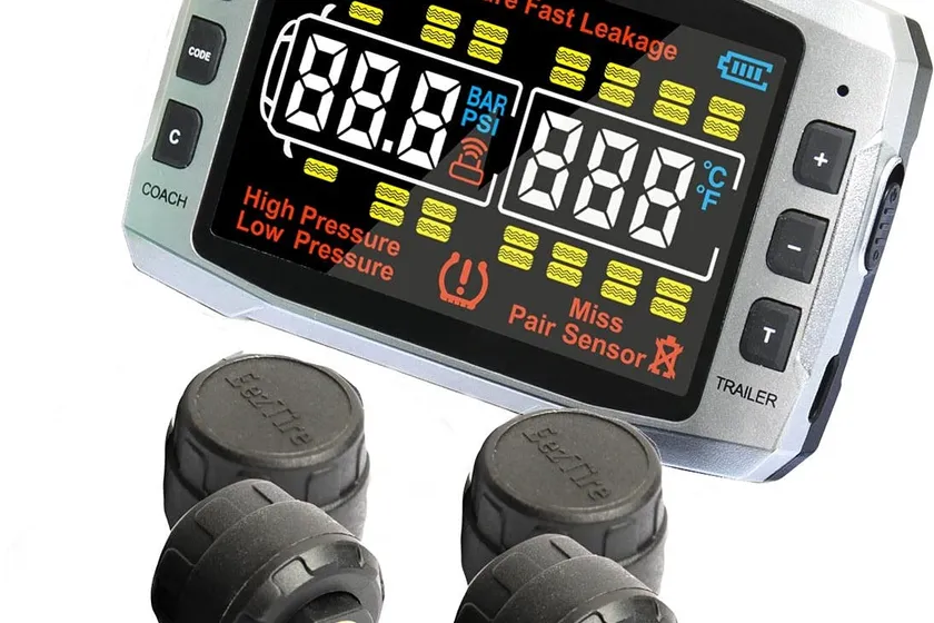 EEZTire TPMS Pro 518C monitor with a 3.5 inch color display beside four anti-theft cap sensors