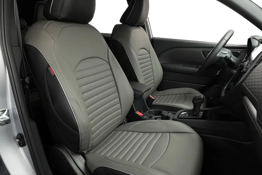 Black and gray EKR custom fit faux leather seat covers installed on a Subaru Forester front and rear seats