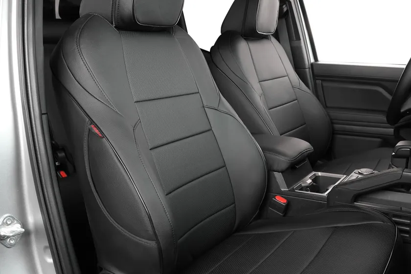 EKR black faux leather full set seat covers installed in a fourth generation Toyota Tacoma double cab