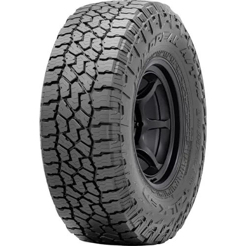 Falken Wildpeak A/T4W light truck tire standing upright, showing its deep all terrain tread and reinforced black sidewall