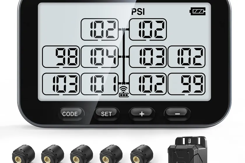 GUTA GT30 trailer TPMS monitor showing multiple tire readings with ten external sensors and a signal booster