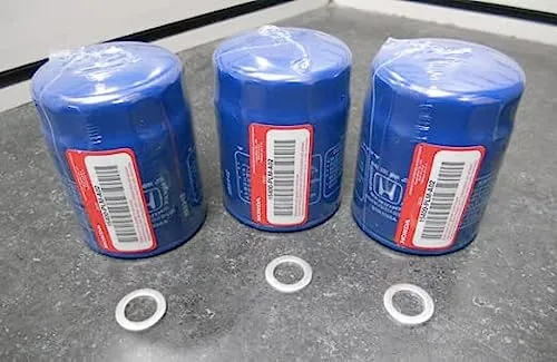 Three blue Genuine Honda 15400-PLM-A02 oil filters lined up with three crush washers