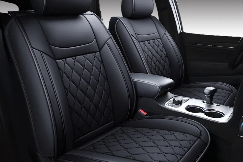 Huidasource black waterproof leather seat covers installed on the front and rear seats of a Jeep Grand Cherokee