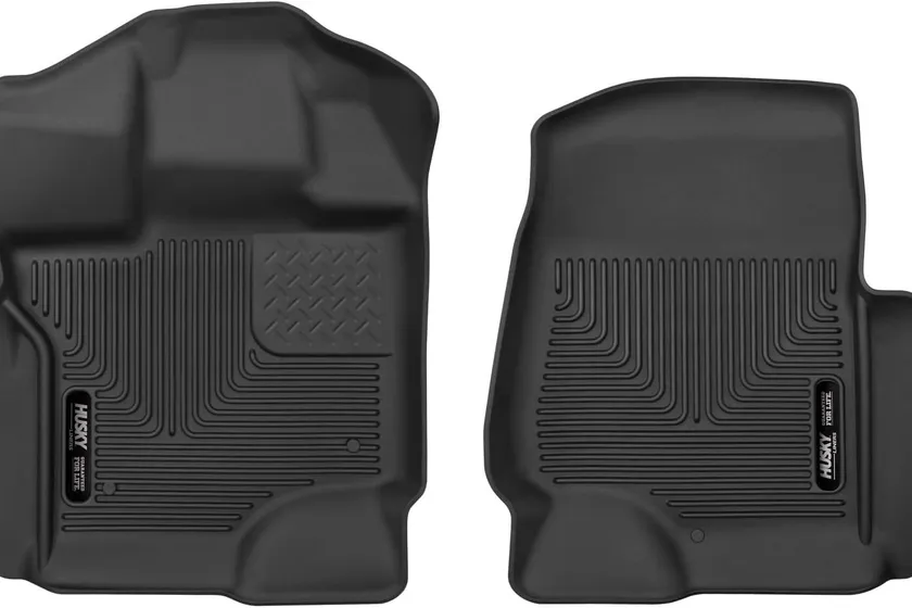 Husky Liners X-act Contour black rubberized floor liners molded to fit a Ford F-150 front footwell