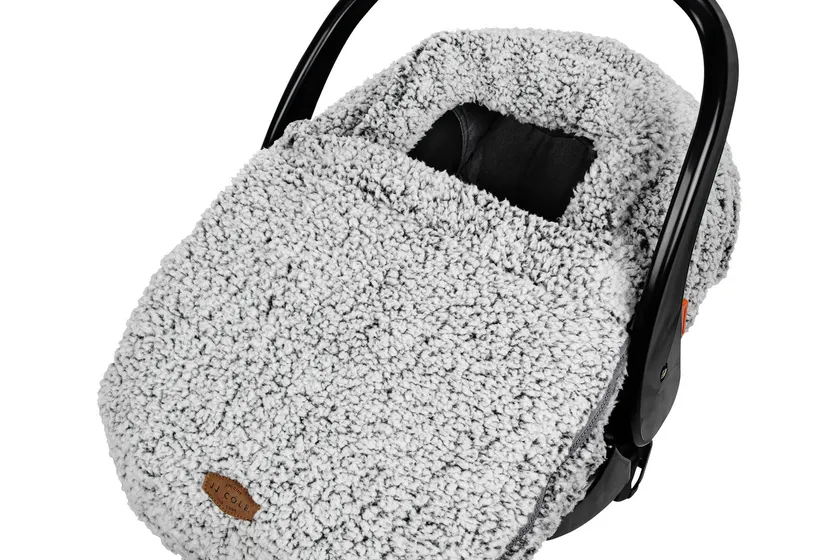 JJ Cole cuddly gray sherpa-lined winter car seat cover stretched over an infant carrier canopy