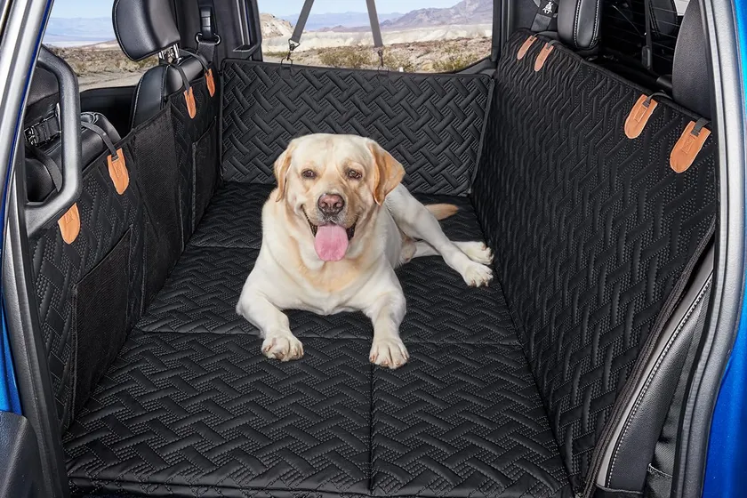 MAXFUT hard-bottom dog back seat extender filling the footwell of a crew cab truck rear seat