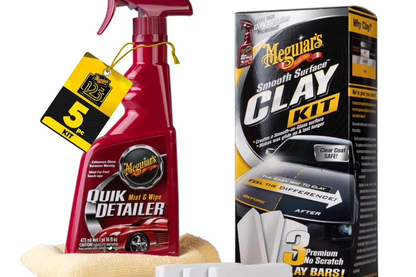 Meguiar's Smooth Surface Clay Kit box with two clay bars, a Quik Detailer spray bottle and a microfiber towel