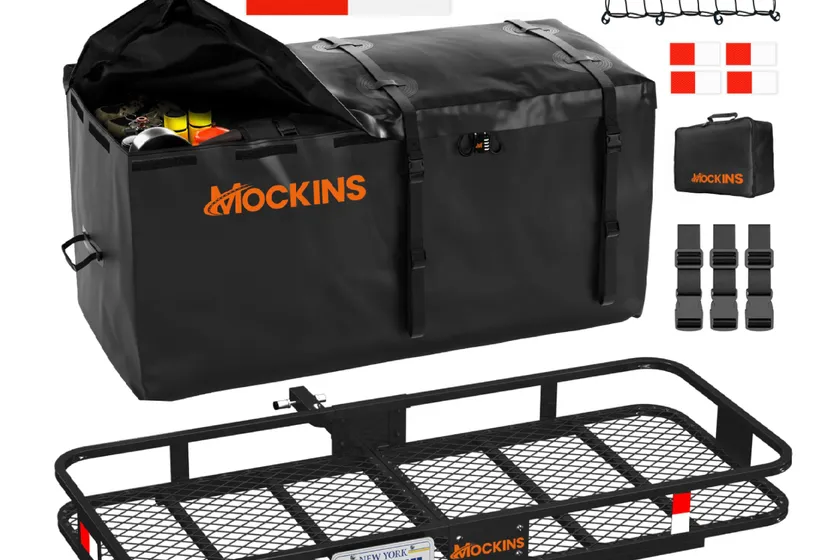 Mockins black steel folding hitch cargo carrier loaded with a large black waterproof cargo bag