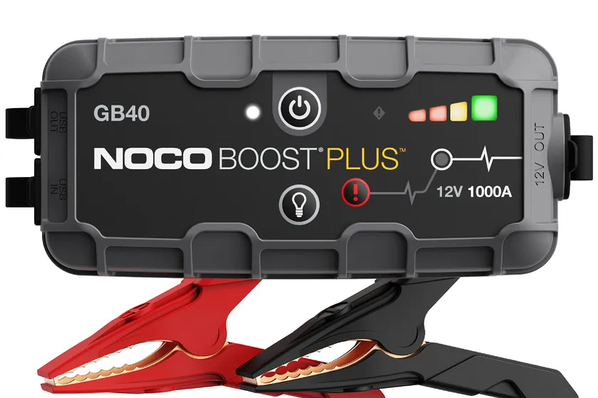 NOCO Boost GB40 orange and black lithium jump starter with attached battery clamps