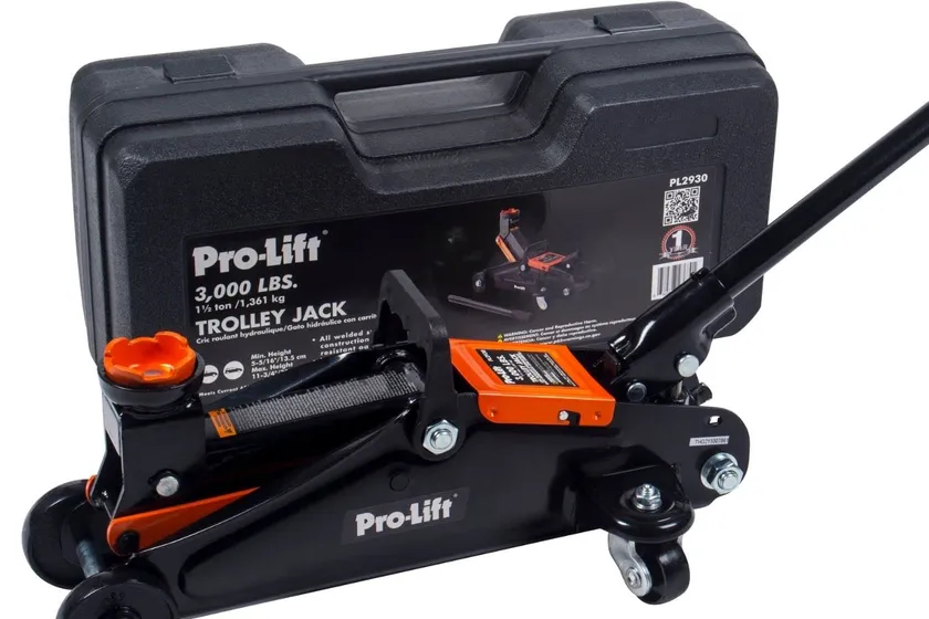 Pro-LifT orange 1.5 ton compact trolley jack with a carry handle beside its black blow molded storage case