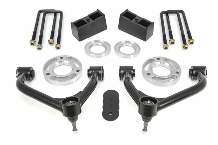 ReadyLIFT SST lift kit with strut extensions, rear blocks and hardware laid out for Silverado and Sierra 1500