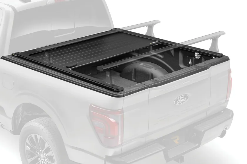 RetraxPRO XR retractable aluminum tonneau cover retracted into its canister on a Ford F-150