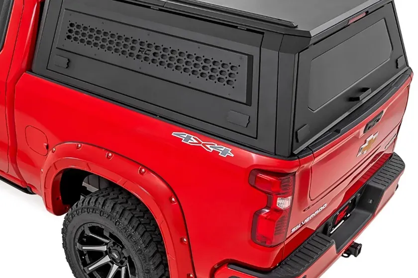 Rough Country black modular hard bed cap topper with gullwing doors on a Silverado 1500