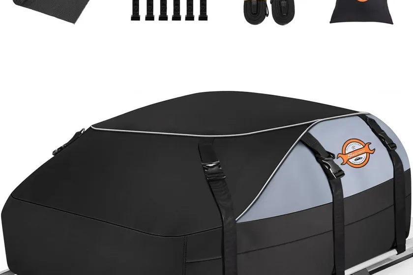 Sailnovo black soft-shell waterproof rooftop cargo bag with six reinforced straps and anti-slip mat on a car roof