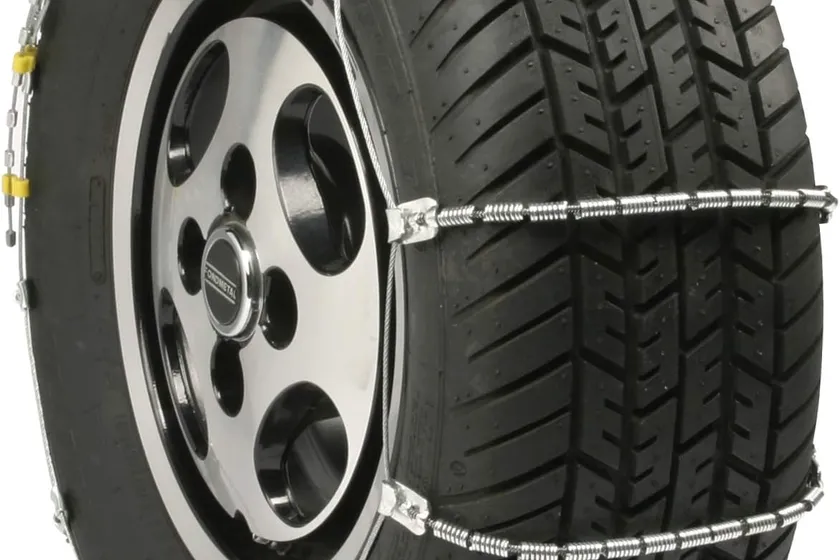 Silver SCC SC1040 radial cable tire chain with steel traction coils spaced along the cross cables