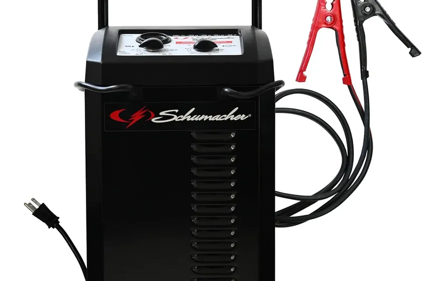 Schumacher SC1445 black wheeled 6 and 12 volt battery charger and 250 amp engine starter on a rolling frame
