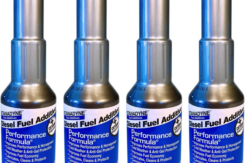Four 8 oz bottles of Stanadyne 38564 Performance Formula diesel fuel additive in a white and blue pack