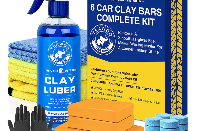 TEAWOO clay bar kit laid out with six clay bars, lubricant tablets, spray bottle, gloves and microfiber towels