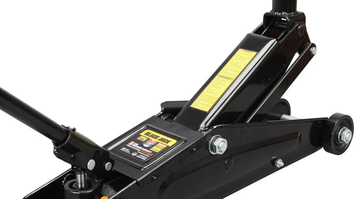 Black steel trolley floor jack with a saddle extension fitted for lifting a raised pickup truck